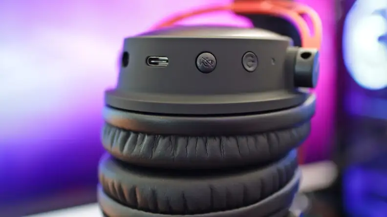 A close up of some buttons on the side of a gaming headset