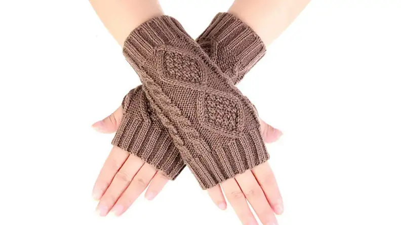 Image of two hands crossed over each other, wearing a pair of beige fingerless gloves.