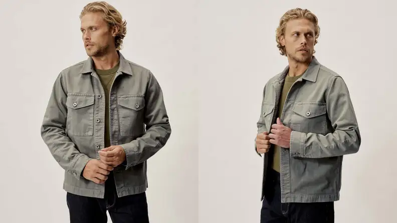 Man wearing a faded army green fatigue jacket from Buck Mason.
