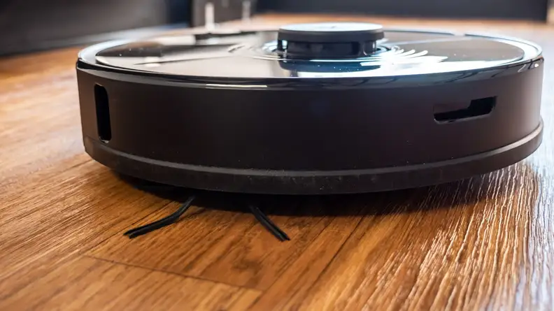 The Roborock S7+ on a hardwood floor.