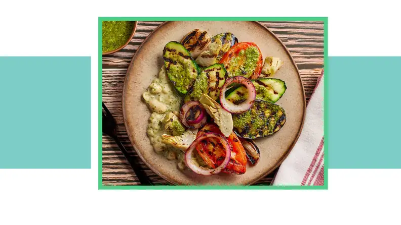 Plate of grilled vegetables and avocado.