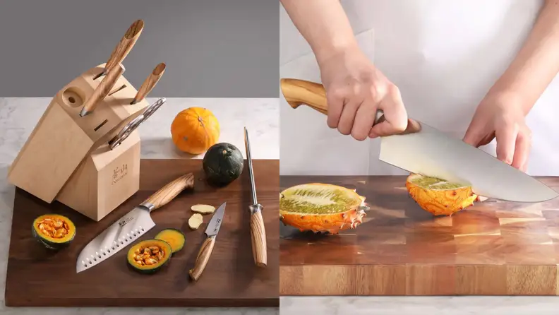 A set of Cangshan knives next to a person cutting fruit with a Cangshan knife on a cutting board.