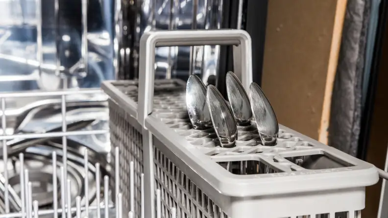 The silverware basket has slots for individual pieces