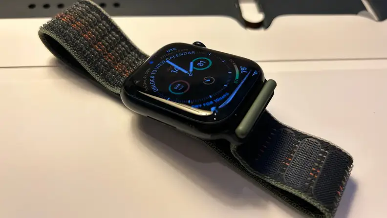 Apple Watch Series 8, in black, lying on a table
