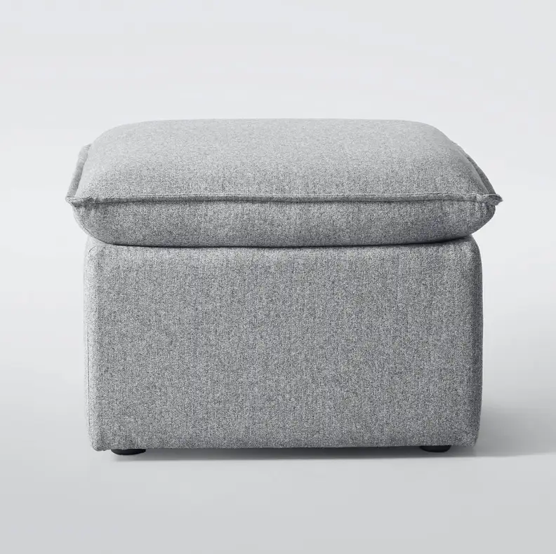 A gray storage ottoman