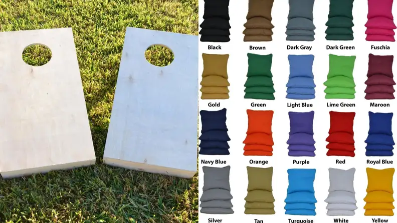 A set of simple wooden cornhole boards and rows of colorful cornhole bags