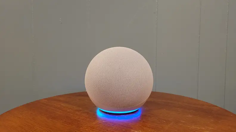 The Amazon Echo powered and on a table