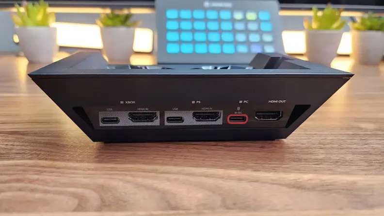 Close-up of the Logitech Astro A50 X base stand, showing the inputs for Xbox, PS5 and PC.