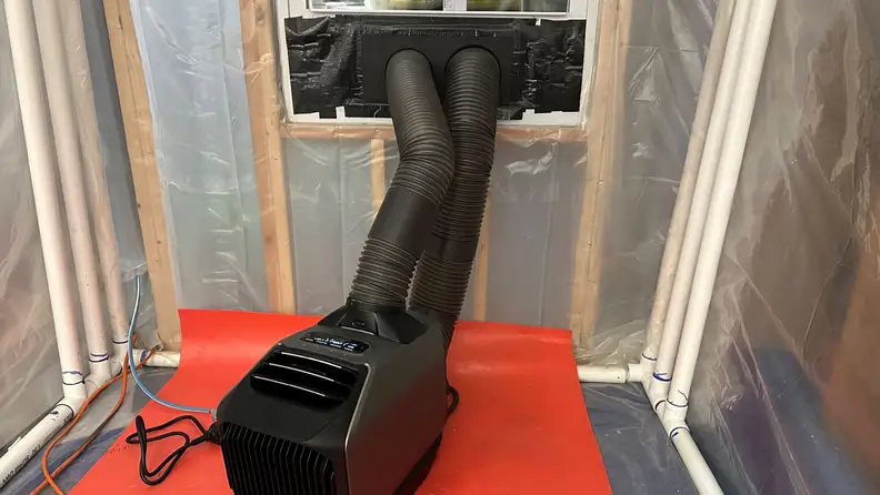 A close-up of the top of the EcoFlow Wave 2 hooked up to a standard window in our testing chamber.