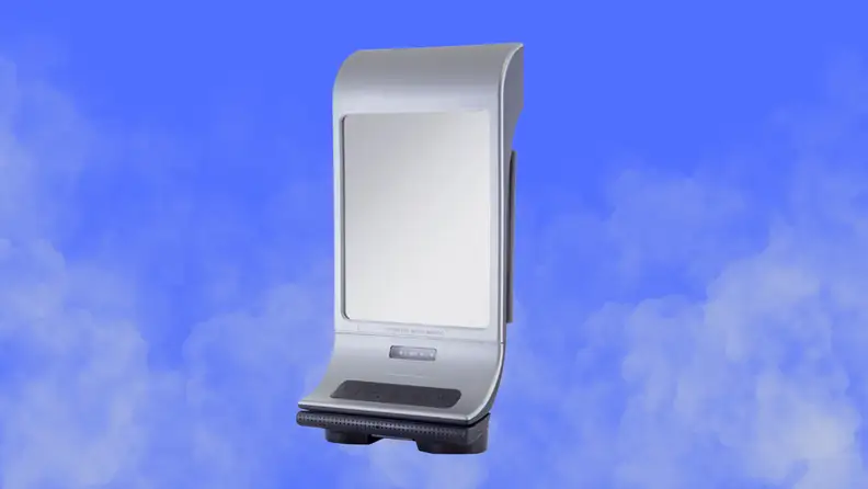 A shower mirror sits on a steamy blue background background