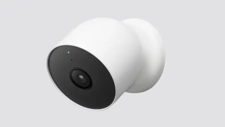 A security camera placed on a gray background