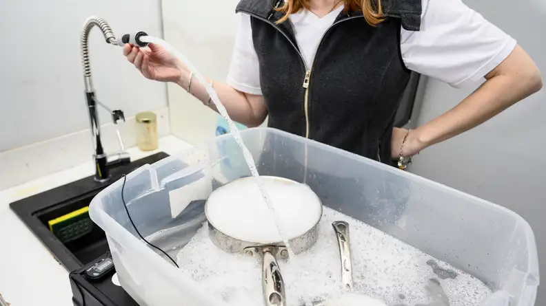 For each dish soaking experiment, we'd fill up a bin with dirty dishes, dish soap, and hot water.