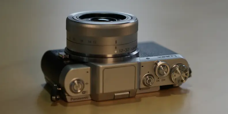 The GF7 eschews a hot shoe in favor of keeping its profile small, including a built-in flash instead.