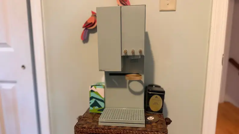 A sage colored coffee machine