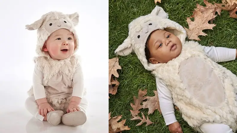 Two infants wear lamb Halloween costumes.