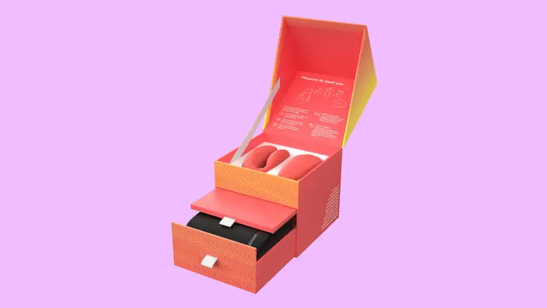 A We-Vibe Chorus inside a packaging box with drawers.