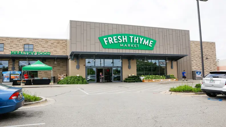 Fresh Thyme Market storefront with produce display outside