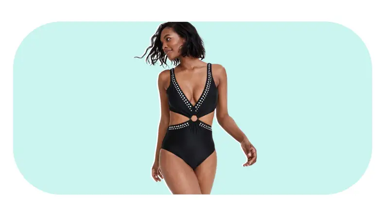 A one-piece monokini with cutout and stud details.