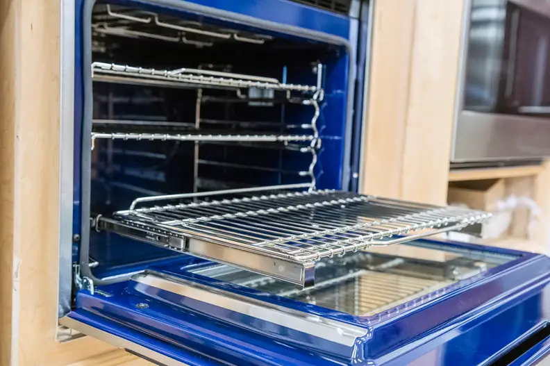 Inside the Wolf E-Series you'll find one standard rack, one full-extension easy-glide rack, and one full extension door-glide rack. Photographed at Boston Appliance in Woburn, MA