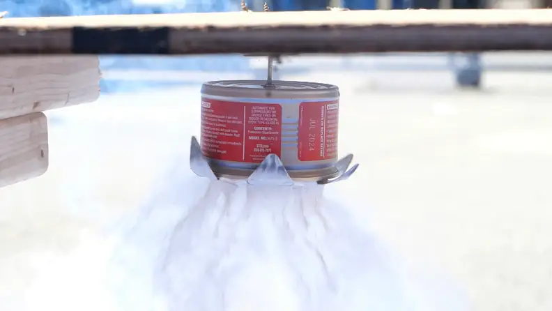The StoveTop FireStop explodes and deploys suppression agent.