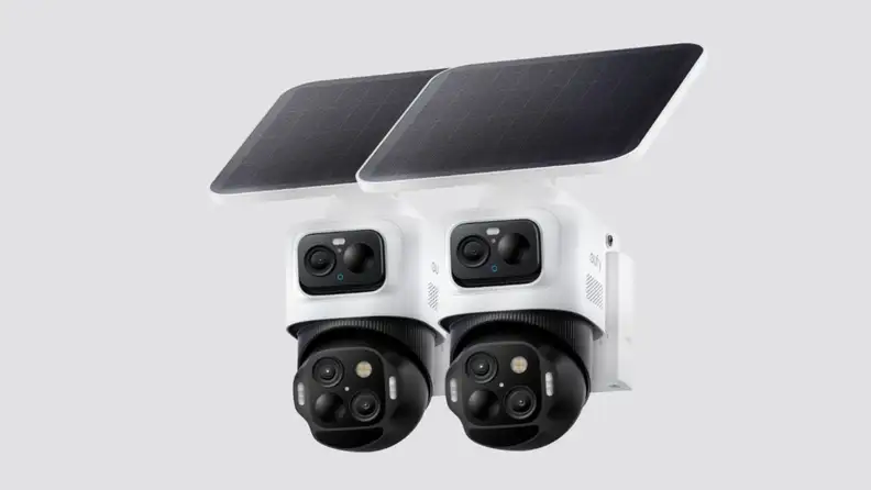 A security camera placed on a gray background