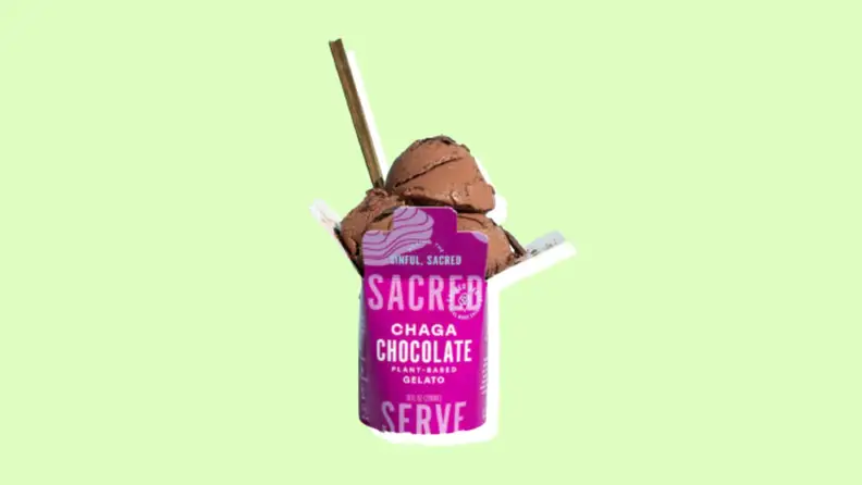 A pink and white container of Scared's Chaga Chocolate plant-based gelato with a lime/yellow background.