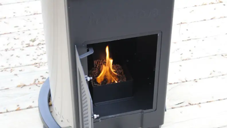 The interior of the Solo Stove Patio Heater with the wood pellets being lit.