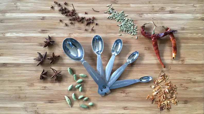 Measuring spices with Cuisipro Measuring Spoons.