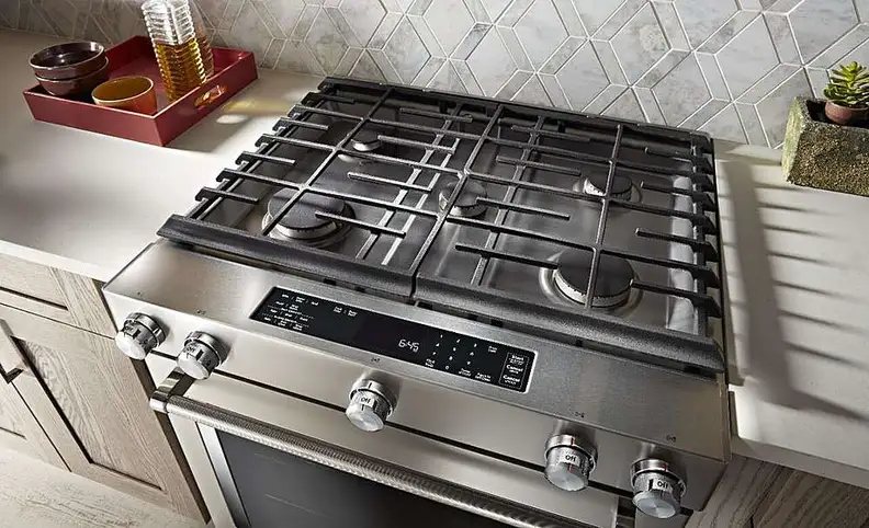 KitchenAid dual fuel range set in a kitchen, shot from above
