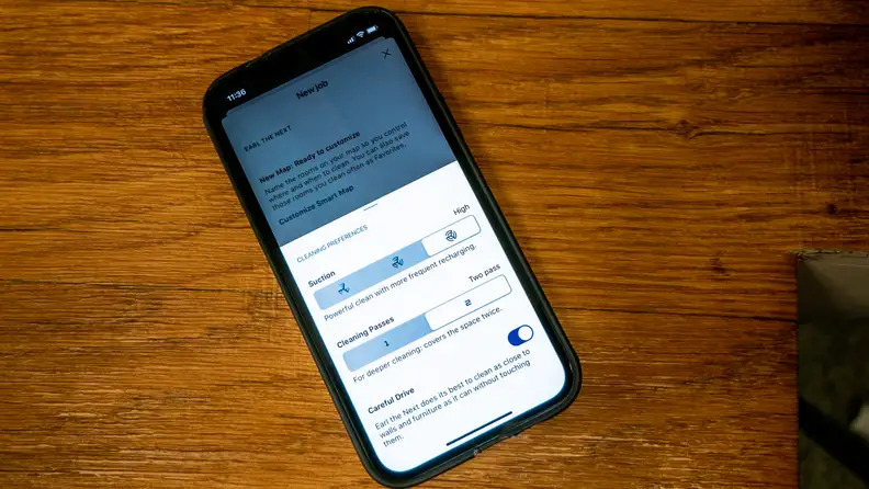 iPhone displaying iRobot OS app.