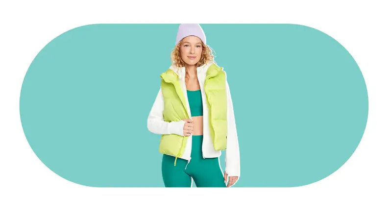 A model wearing a bright green puffer vest.