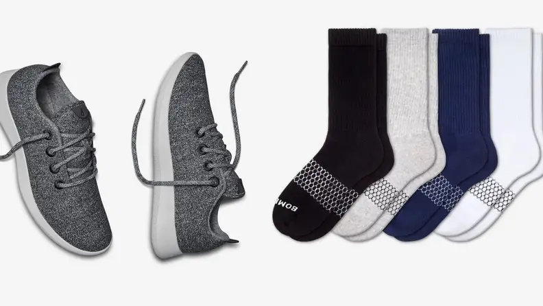 A pair of gray shoes and multicolored socks.