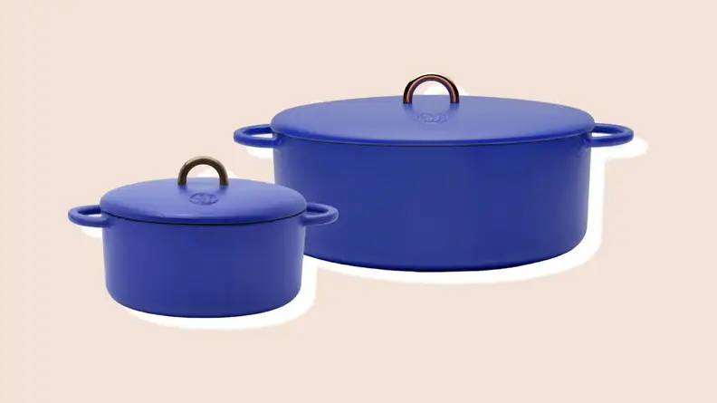 The 3.5-quart Dutch Baby cast-iron Dutch oven next to the 6.75-quart enameled cast-iron Dutchess Dutch oven, both in Blueberry color.