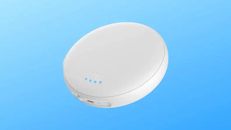White circular alarm device.
