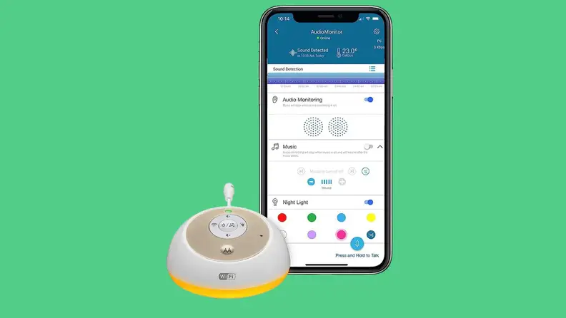 The Motorola MBP163 Connect audio baby monitor and smartphone with app against a green background.