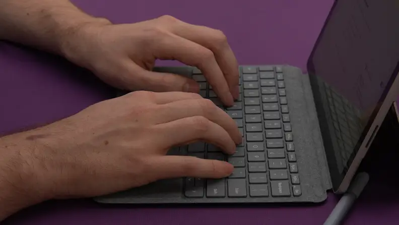 Person typing on the keyboard