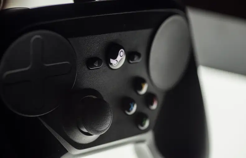 A close-up photo of the Valve Steam Controller's front control interface.