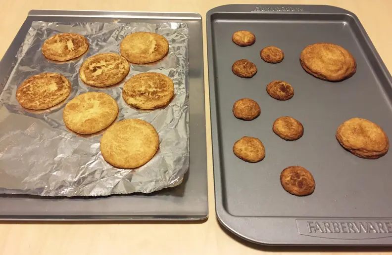 Cookies on aluminum foil and baking sheet