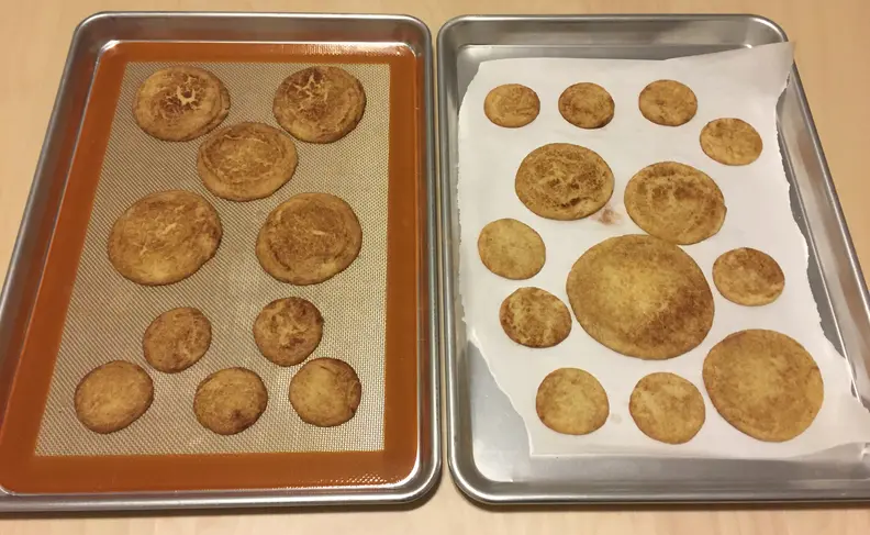 Baking mat and parchment paper on pans