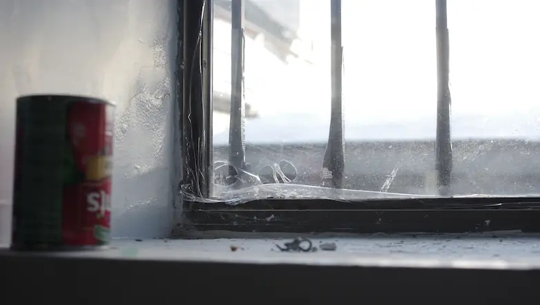 A hole is burned in the window film.