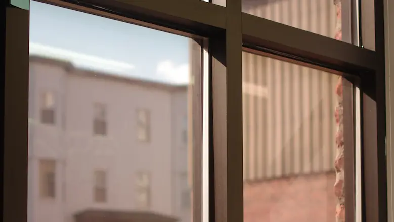 Windows are tinted with black film.