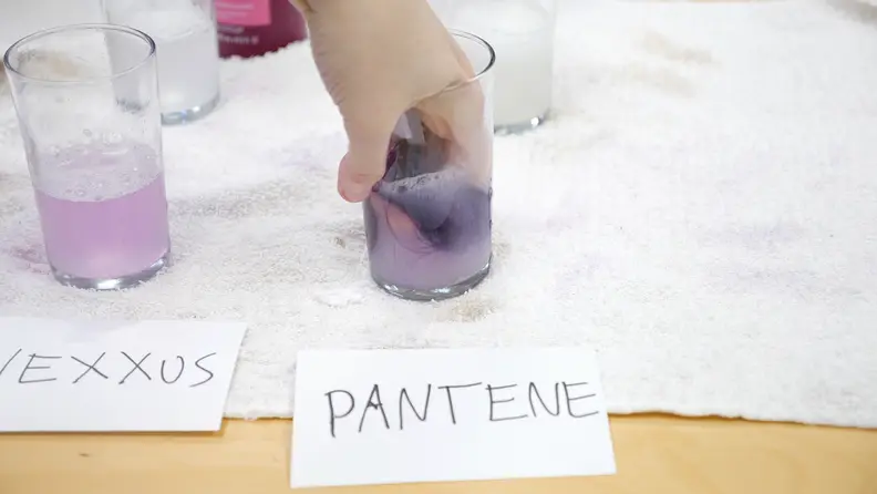 Each hair swatch was swished in a glass of shampoo and water for 5 seconds.