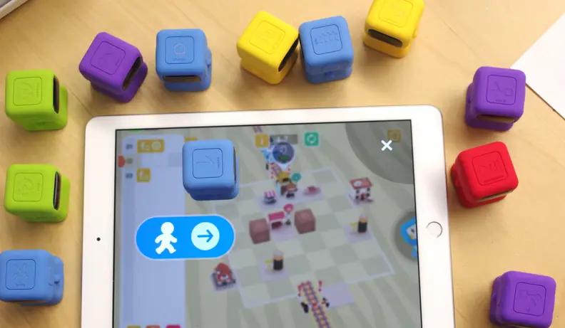 Tangiplay is a coding kit wherein kids place specific figurines on a tablet to solve coding puzzles.