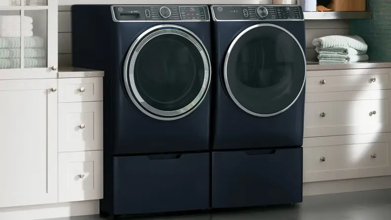 Images of a GE washing machine and dryer in a laundry room.