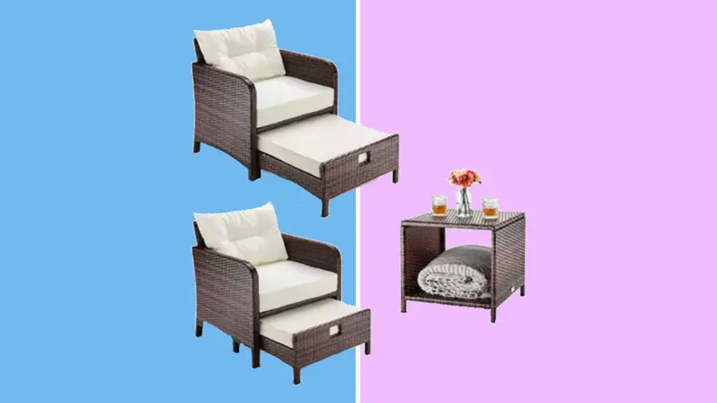 An image of two brown wicker patio chairs with cream-colored cushions and pullout ottomans, alongside a matching coffee table.