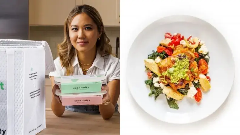A person holding CookUnity meal kit packages and a plate of colorful food.