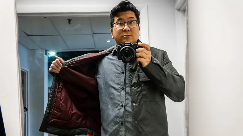 Man showing the inside of his jacket