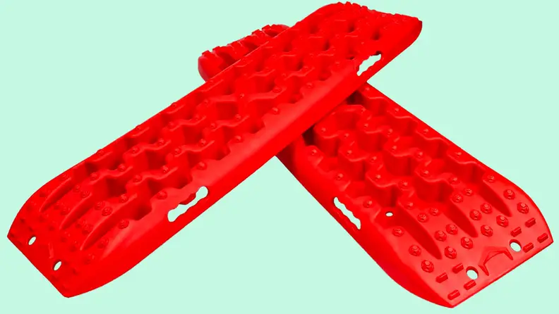 A traction ramp against a blue background.