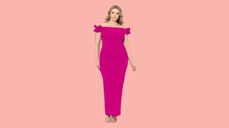 A model wearing a pink off-the-shoulder gown with bow details.