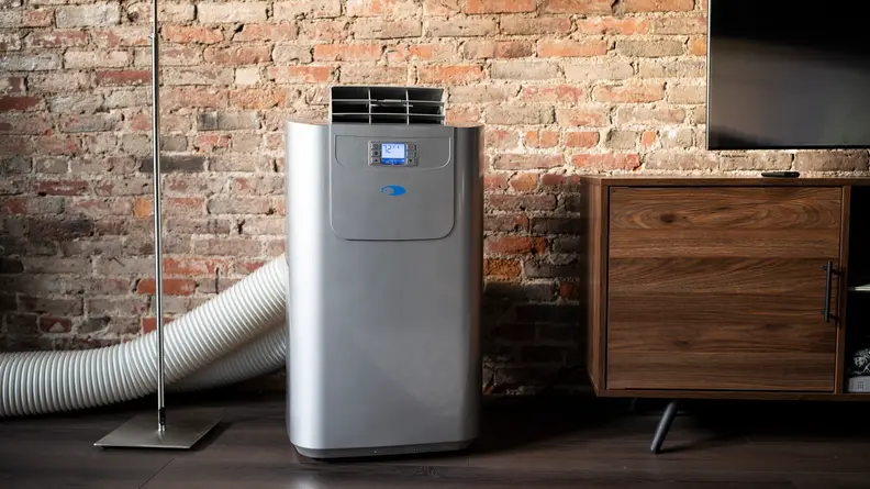 A Whynter portable air conditioner, properly installed and venting offscreen.